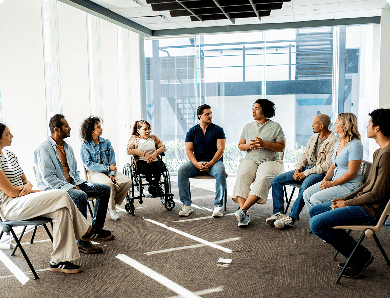 People sitting in a group discussion circle.