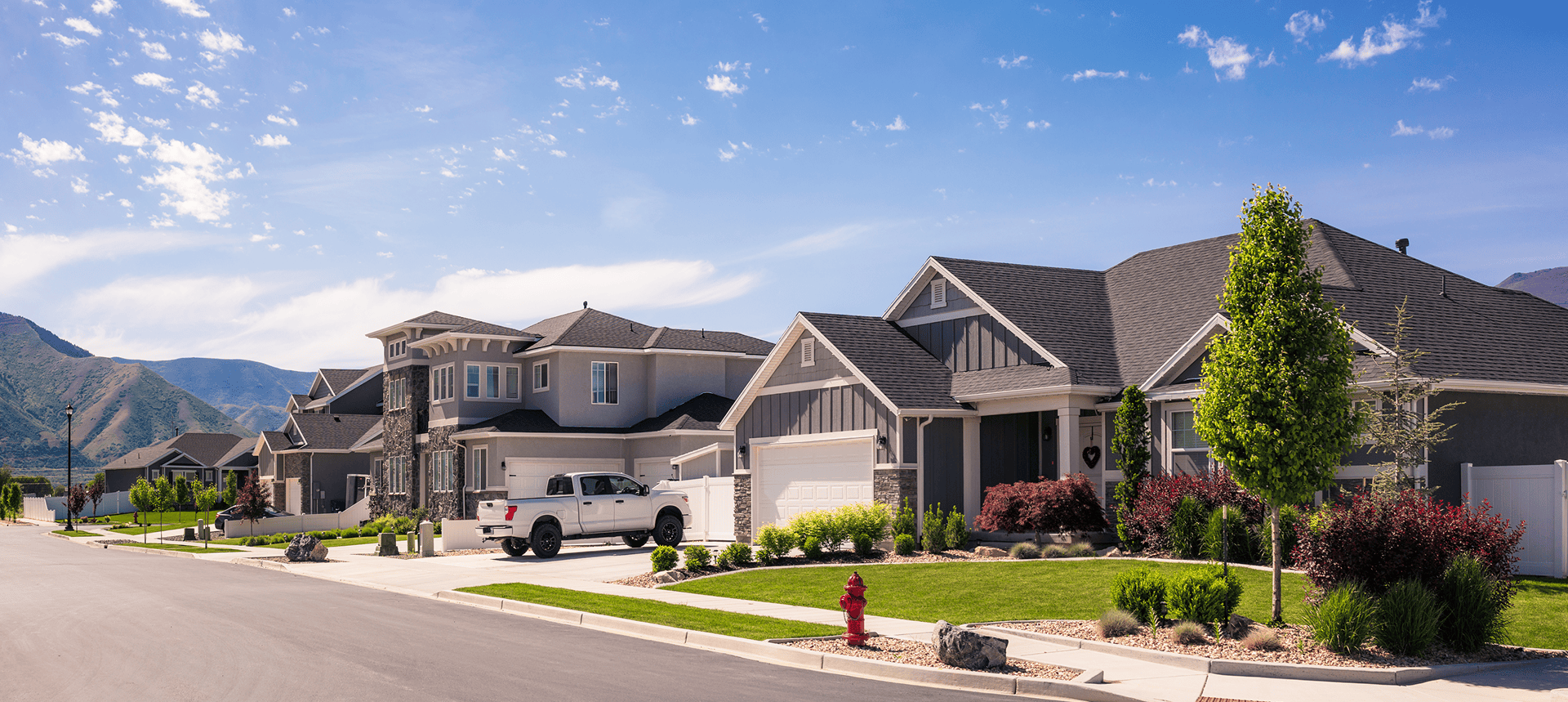 Suburban neighborhood with modern houses and landscaping.