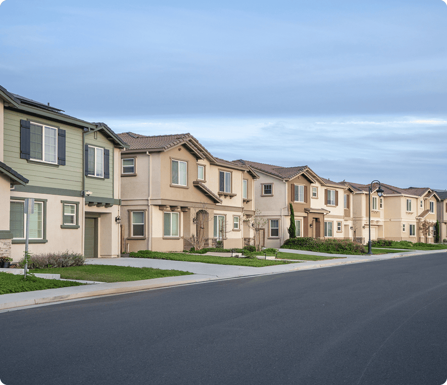 Row of suburban houses along street.